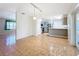 Open floor plan with tile flooring connecting the living and kitchen areas. Sliding doors allow for outdoor access at 2705 21St W Ave, Bradenton, FL 34205