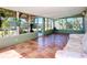 Sunroom featuring tile floors and large windows overlooking the backyard at 2705 21St W Ave, Bradenton, FL 34205