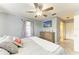 Calm bedroom featuring a ceiling fan, natural light, and closet space, designed for comfortable living at 3119 40Th W Ave, Bradenton, FL 34205
