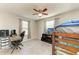 Bedroom featuring natural light, wood trim, and modern ceiling fan at 3119 40Th W Ave, Bradenton, FL 34205