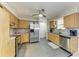Functional kitchen with stainless steel appliances, granite countertops, and ample cabinet space at 3119 40Th W Ave, Bradenton, FL 34205