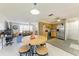 Open-concept kitchen and living room with plenty of natural light and stainless steel appliances at 3119 40Th W Ave, Bradenton, FL 34205