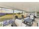 Screened-in patio showing spacious seating area and an expansive backyard view at 3119 40Th W Ave, Bradenton, FL 34205