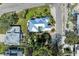 A birds eye view of a beautiful luxury home that features a large pool and metal roof at 412 73Rd St, Holmes Beach, FL 34217