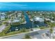 Aerial view of waterfront community with canals, boats, and houses at 412 73Rd St, Holmes Beach, FL 34217