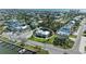 Captivating aerial view of charming coastal home with lush landscaping near the serene waterfront at 412 73Rd St, Holmes Beach, FL 34217