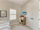 Comfortable bedroom features a trundle bed, desk with chair, and white door at 412 73Rd St, Holmes Beach, FL 34217
