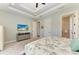Bedroom features tray ceilings, television, two doorways and carpet at 412 73Rd St, Holmes Beach, FL 34217
