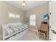 Cozy bedroom featuring a daybed, desk, and shuttered windows, creating a comfortable space at 412 73Rd St, Holmes Beach, FL 34217