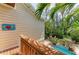 Picturesque outdoor patio featuring a small pool, seating area, grill, and lush greenery at 412 73Rd St, Holmes Beach, FL 34217