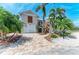Charming two-story home featuring a brick driveway, lush landscaping, and inviting curb appeal at 412 73Rd St, Holmes Beach, FL 34217