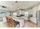 Well-equipped kitchen with a breakfast bar, granite countertops, and stainless steel appliances at 412 73Rd St, Holmes Beach, FL 34217
