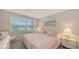 Relaxing bedroom with waterfront views and comfy decor at 4350 Chatham Dr # E-105, Longboat Key, FL 34228