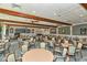 Large clubhouse with ample seating, ceiling fans and a fireplace for gatherings at 4350 Chatham Dr # E-105, Longboat Key, FL 34228