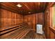 Warm, wood-paneled sauna with bench seating and a heater, perfect for relaxation at 4350 Chatham Dr # E-105, Longboat Key, FL 34228