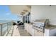 Balcony featuring an outdoor kitchen with a built-in grill and stunning views of the water at 464 Golden Gate Pt # 702, Sarasota, FL 34236
