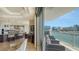 Balcony with seating overlooking the kitchen and a water view at 464 Golden Gate Pt # 702, Sarasota, FL 34236
