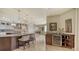 Bright kitchen featuring a bar area, two islands, and seamless transition to dining area and other living spaces at 464 Golden Gate Pt # 702, Sarasota, FL 34236