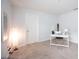Neutrally decorated bedroom with a desk, chair, globe, and decorative print at 4781 Vignette Way, Sarasota, FL 34240