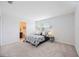 Bright bedroom features a neutral color scheme and an ensuite bathroom at 4781 Vignette Way, Sarasota, FL 34240