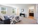 Bedroom featuring large windows, a console table and access to the Primary bathroom at 4781 Vignette Way, Sarasota, FL 34240