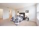 Bedroom displaying a black and white bedding set with natural lighting and a decorative plant at 4781 Vignette Way, Sarasota, FL 34240