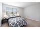 Well-lit bedroom with a large window offering natural light at 4781 Vignette Way, Sarasota, FL 34240