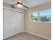 Bedroom featuring a closet, natural light, and neutral color palette at 4823 Linwood St, Sarasota, FL 34232