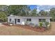 Charming single story home features a tidy front yard and lovely curb appeal at 4823 Linwood St, Sarasota, FL 34232
