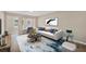 Bright staged living room showcasing a modern couch and a stylish area rug at 4823 Linwood St, Sarasota, FL 34232