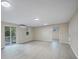Open living room featuring light floors, natural light, mini-split A/C, and access to outdoors at 4823 Linwood St, Sarasota, FL 34232