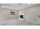 Bright and airy living room featuring a fireplace, smooth floors and ample natural light at 4823 Linwood St, Sarasota, FL 34232