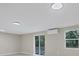 Bright living room featuring light floors, natural light, and mini-split A/C at 4823 Linwood St, Sarasota, FL 34232