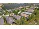 Beautiful aerial view of homes in a waterfront community with a marina and lush green landscaping at 5009 Lake Overlook Ave, Bradenton, FL 34208