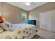 Bright bedroom with plush carpet, closet, neutral paint, and marine-themed comforter at 5009 Lake Overlook Ave, Bradenton, FL 34208