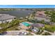 Community pool with comfortable lounge chairs and a view of the marina and the surrounding community at 5009 Lake Overlook Ave, Bradenton, FL 34208