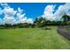 Spacious dog park with lush green grass, providing a perfect space for furry friends to play and socialize at 5009 Lake Overlook Ave, Bradenton, FL 34208