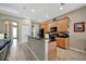 Open concept kitchen has stainless appliances, wood cabinets and breakfast bar with seating at 5009 Lake Overlook Ave, Bradenton, FL 34208