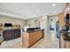 Open kitchen featuring granite countertops and seamlessly blending into the living area at 5009 Lake Overlook Ave, Bradenton, FL 34208