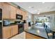 Modern kitchen features stainless steel appliances, granite countertops, and ample cabinet space at 5009 Lake Overlook Ave, Bradenton, FL 34208