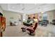 Comfortable living space with tray ceiling, open layout, and combined kitchen/living at 5009 Lake Overlook Ave, Bradenton, FL 34208
