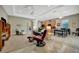 Comfortable living space with tray ceiling, open layout, and combined kitchen/living at 5009 Lake Overlook Ave, Bradenton, FL 34208