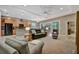 Inviting living room showcasing an open floor plan with sliding glass doors to the outdoors at 5009 Lake Overlook Ave, Bradenton, FL 34208