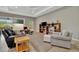 Spacious living room features a decorative ceiling fan and lots of natural light at 5009 Lake Overlook Ave, Bradenton, FL 34208