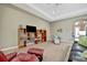 Stylish living room featuring built in shelving and lots of natural light at 5009 Lake Overlook Ave, Bradenton, FL 34208