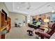 Comfortable living space with tray ceiling, open layout, and combined kitchen/living at 5009 Lake Overlook Ave, Bradenton, FL 34208
