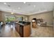 Spacious living area with tile flooring, ceiling fans, and access to outdoor patio at 5009 Lake Overlook Ave, Bradenton, FL 34208