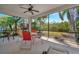 Spacious screened-in patio featuring outdoor seating with lush tropical surroundings at 5009 Lake Overlook Ave, Bradenton, FL 34208