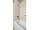 Close-up of the shower/tub featuring white tiles and brushed metal fixtures at 5009 Lake Overlook Ave, Bradenton, FL 34208