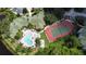 Aerial view of the community showing the pool, spa, tennis court, and community building at 5134 Northridge Rd # 106, Sarasota, FL 34238